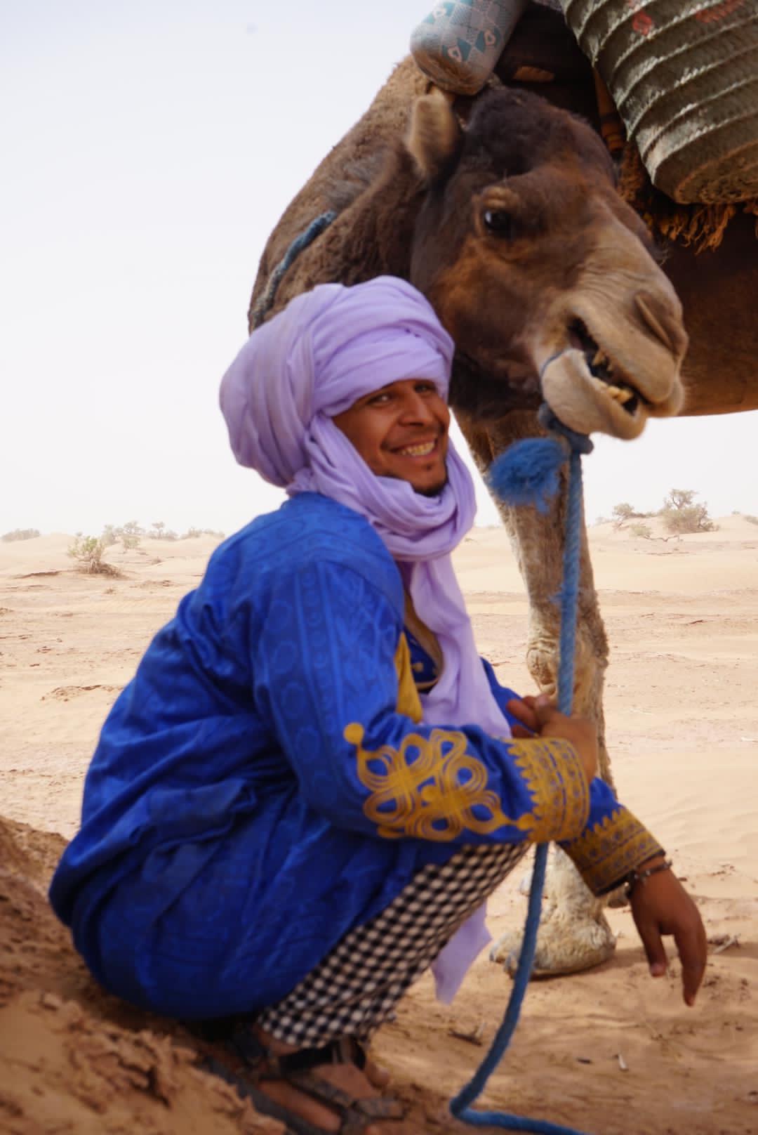 Nomad guide walking in dunes